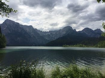 Scenic view of lake and mountains against sky