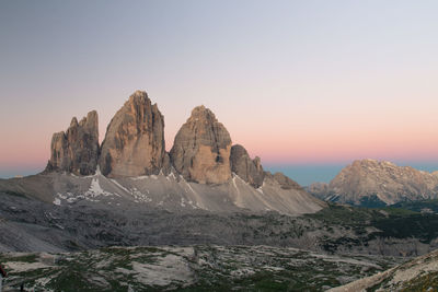 Rock formations on landscape against clear sky