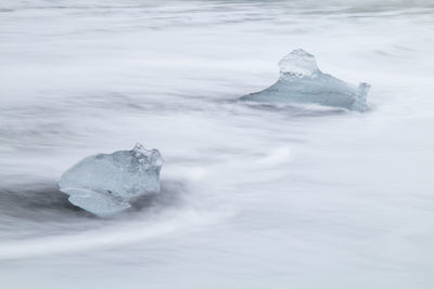 Rocks in sea during winter