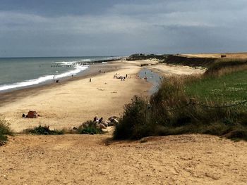 Scenic view of beach against sky