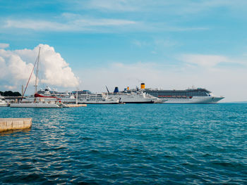 Ship sailing in sea against sky