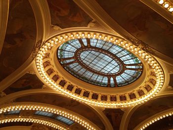 Low angle view of illuminated municipal house ceiling