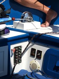 Cropped image of woman against blue sky