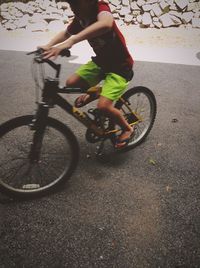 Man riding bicycle on street