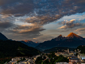 Scenic view of residential buildings against sky during sunset