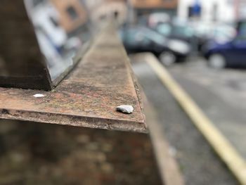 Close-up of rusty metal on street