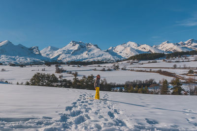 Scenic view of snowcapped mountains against sky