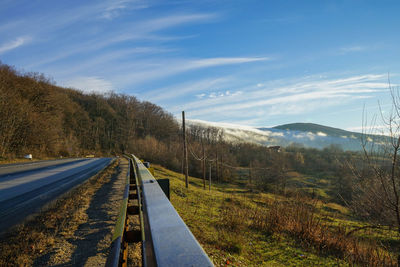 Road amidst landscape against sky