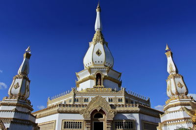 Pagoda of phra maha chedi chai mongkol temple, roi et, thailand. religion and landmark concept.