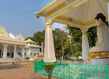 View of temple against building