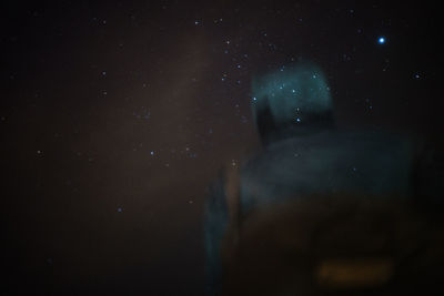 Light painting against sky at night