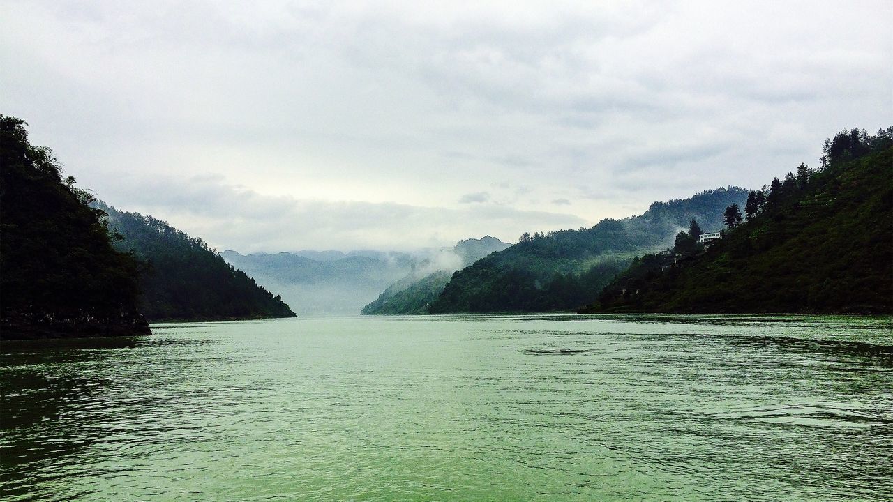 water, tranquil scene, waterfront, scenics, tranquility, sky, beauty in nature, mountain, lake, tree, nature, rippled, cloud - sky, river, idyllic, cloud, non-urban scene, mountain range, cloudy, outdoors