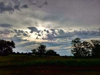 Scenic view of field against sky during sunset