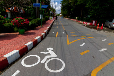 Bicycle lane sign on street in city