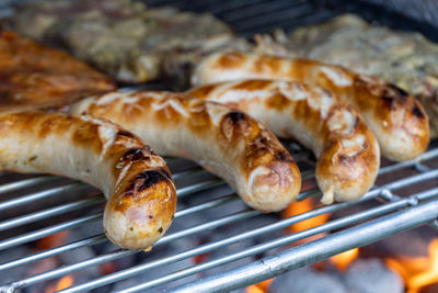 High angle view of meat on barbecue grill