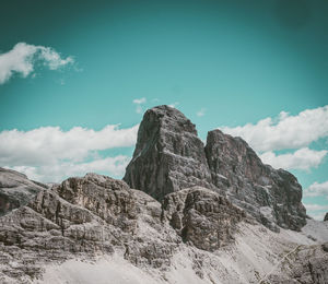 Low angle view of rock formation against sky