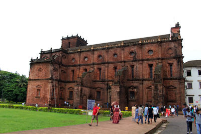 Group of people in front of historical building