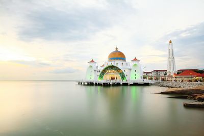 View of temple against cloudy sky