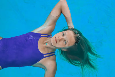 High angle view of woman swimming in pool