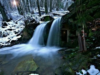 Scenic view of waterfall in forest