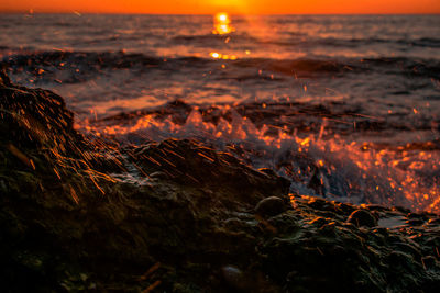 Scenic view of sea against sky during sunset