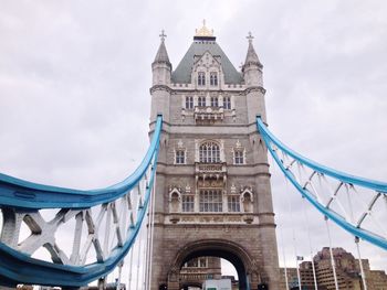 Low angle view of tower bridge against sky