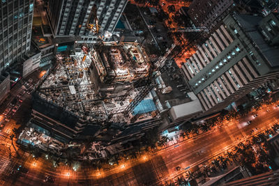 Aerial view of city lit up at night