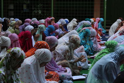 Large group of women praying