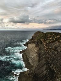Scenic view of sea against cloudy sky