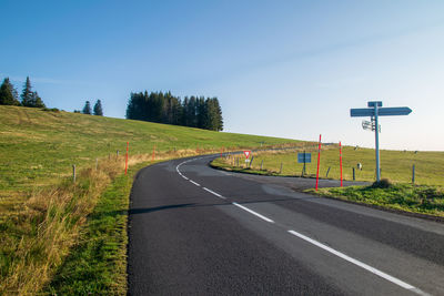 Country road against clear sky