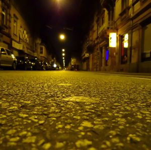 Surface level of yellow illuminated city at night