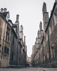 Street amidst buildings against sky in city