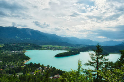 Scenic view of lake and mountains against sky