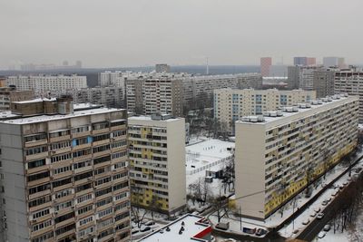 High angle view of buildings in city against sky