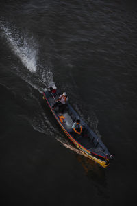 High angle view of people sailing on sea