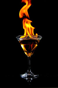 Close-up of fire cocktail against black background