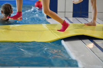 Low section of woman in swimming pool