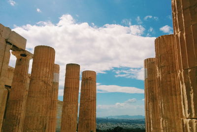 Old ruins at acropolis of athens against sky