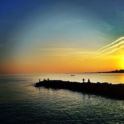 Scenic view of sea at sunset