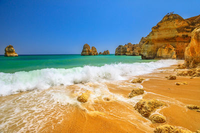 Scenic view of sea against blue sky