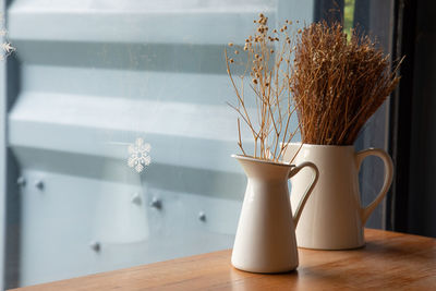 Close-up of white flower vase on table