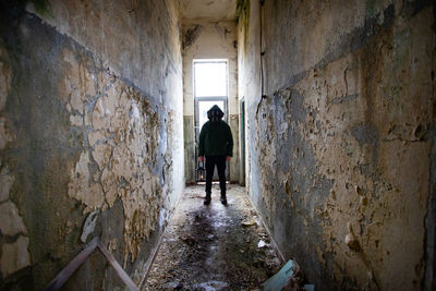 Man standing in abandoned building