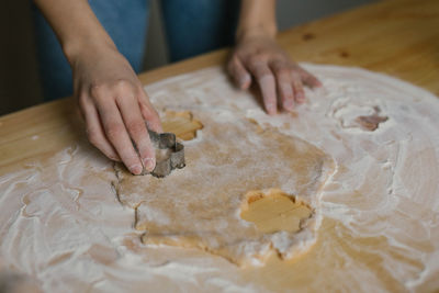 Young woman making christmas cookies