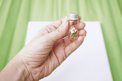 Close-up of hand holding pills