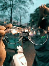 Midsection of person holding glass