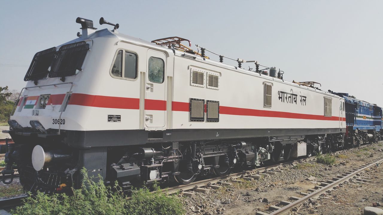 transportation, rail transportation, mode of transportation, railroad track, track, train - vehicle, train, public transportation, sky, nature, no people, land vehicle, day, clear sky, passenger train, outdoors, travel, stationary, white color, locomotive