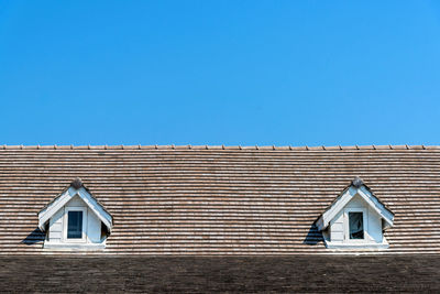 Low angle view of building against blue sky