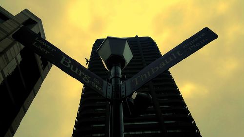 Low angle view of built structure against sky at sunset