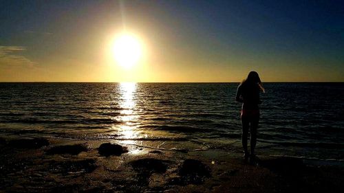 Scenic view of sea at sunset