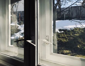 Reflection of house on glass window